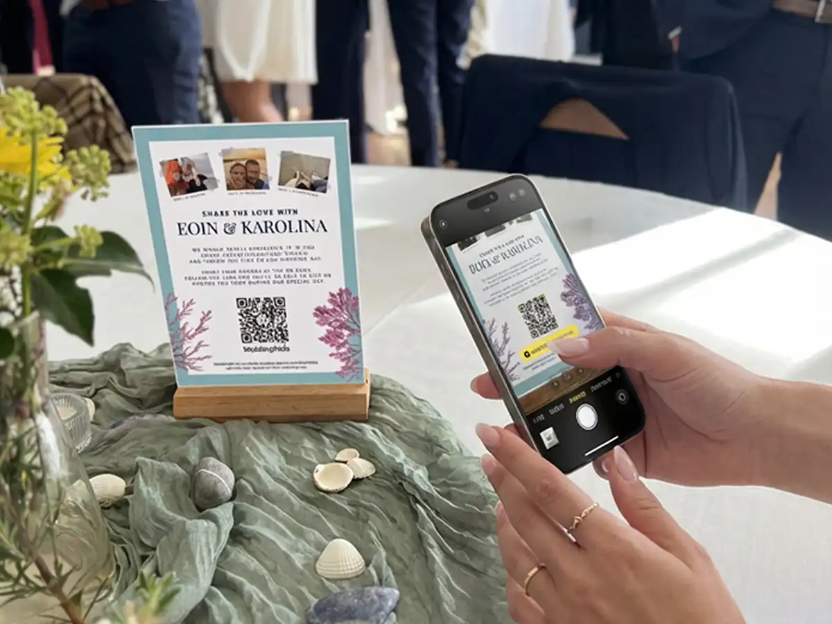 A Wedding Guest Scanning a QR code sign